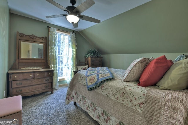 carpeted bedroom with vaulted ceiling and ceiling fan