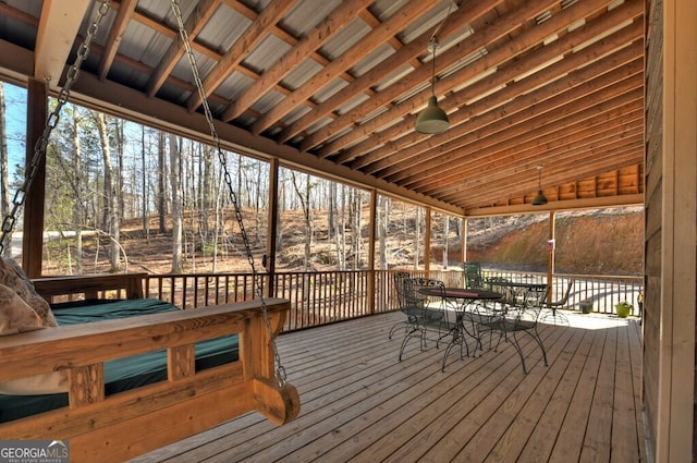 wooden terrace featuring outdoor dining area
