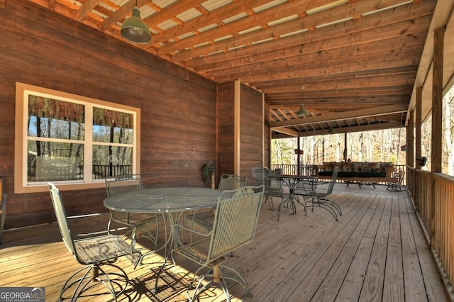 wooden deck with outdoor dining space