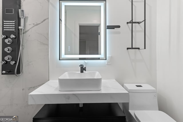 bathroom with vanity and toilet