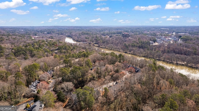 bird's eye view with a water view and a view of trees