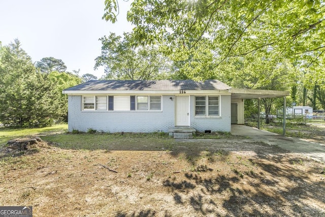 116 Mockingbird Ln, Warner Robins, GA 31093 - ranch-style home with fence, entry steps, driveway, a carport, and brick siding