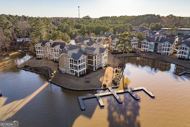 bird's eye view featuring a water view and a view of trees