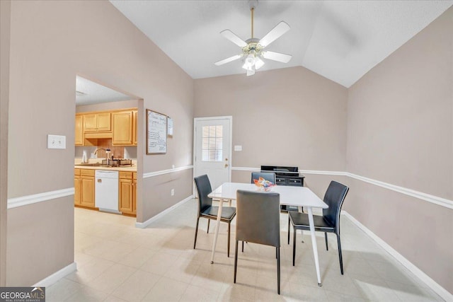 dining room with a ceiling fan, lofted ceiling, and baseboards