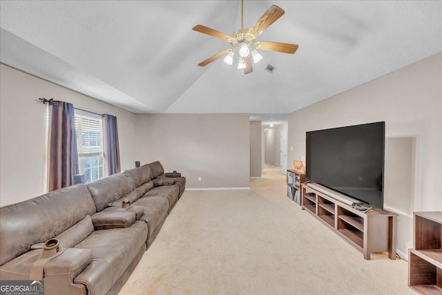 carpeted living area featuring visible vents, baseboards, ceiling fan, vaulted ceiling, and a textured ceiling