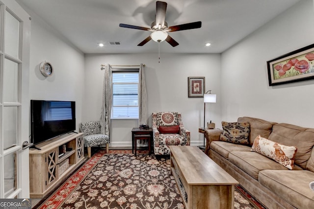 living room featuring recessed lighting, ceiling fan, visible vents, and baseboards