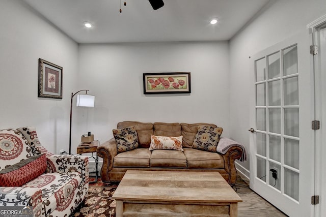 living room featuring a ceiling fan and recessed lighting