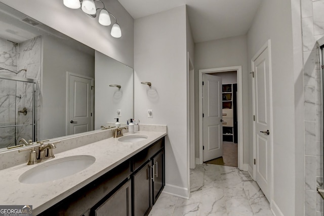 full bathroom with a sink, visible vents, marble finish floor, and a stall shower