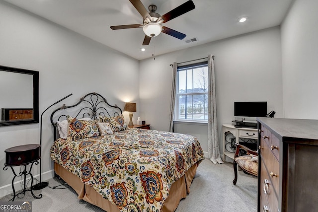 bedroom featuring visible vents, baseboards, light colored carpet, recessed lighting, and a ceiling fan