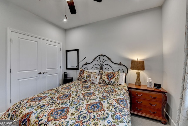 bedroom featuring a ceiling fan, a closet, carpet floors, and baseboards