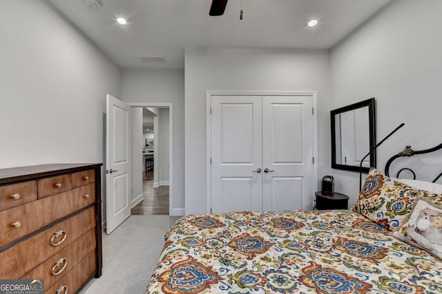 carpeted bedroom with a closet, visible vents, recessed lighting, and ceiling fan