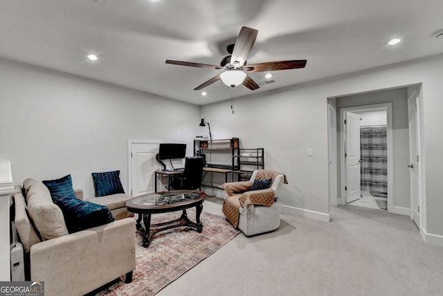 carpeted living room featuring baseboards, ceiling fan, and recessed lighting