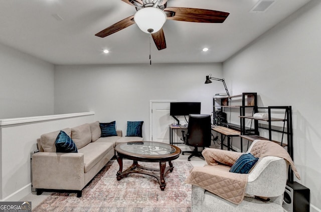 living area featuring a ceiling fan, baseboards, visible vents, and recessed lighting