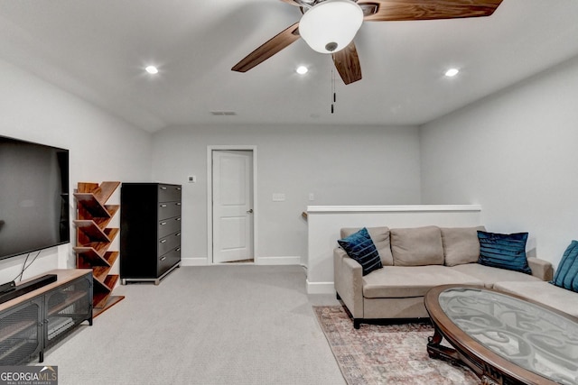 living area featuring a ceiling fan, visible vents, baseboards, recessed lighting, and light colored carpet