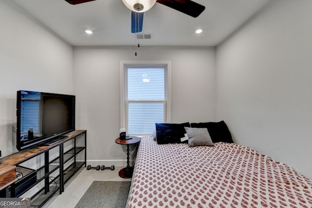 bedroom with ceiling fan, visible vents, baseboards, and carpet