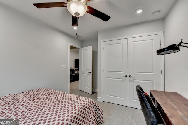 bedroom with a closet, recessed lighting, ceiling fan, and light colored carpet
