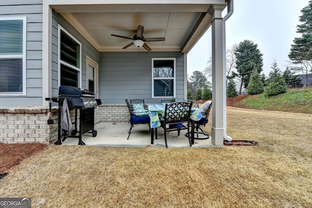 view of patio with ceiling fan and a grill