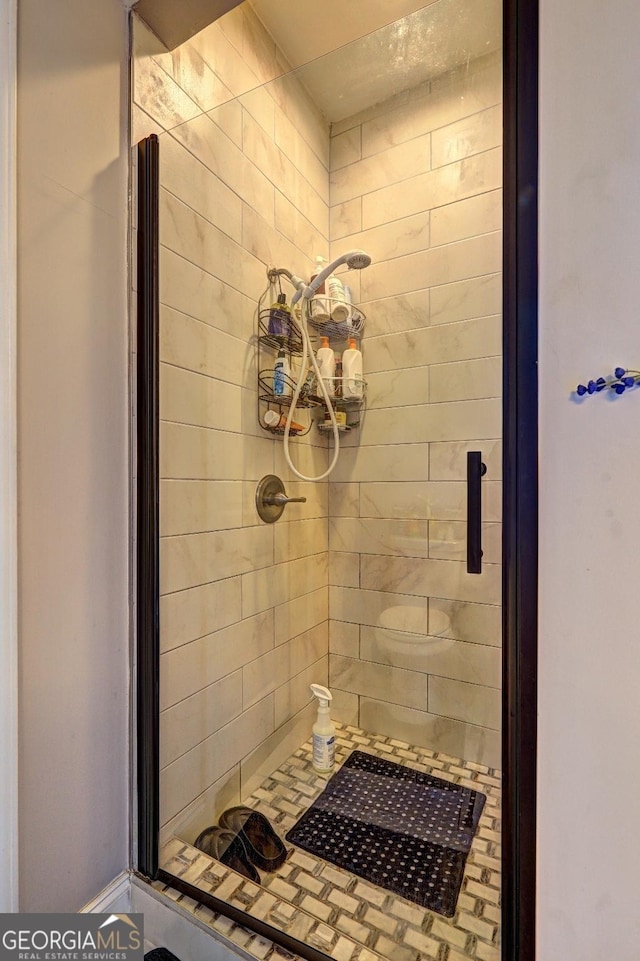 full bathroom featuring a shower stall