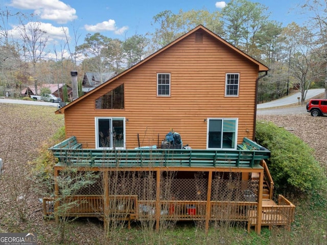 rear view of property with a deck