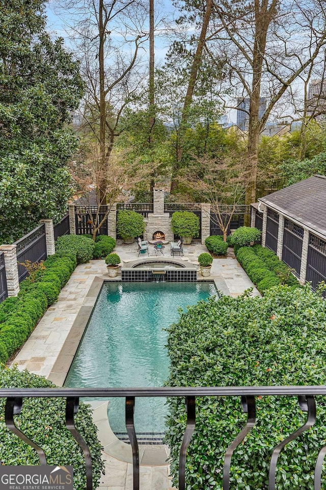 view of swimming pool with a patio area, a fenced in pool, and a fenced backyard