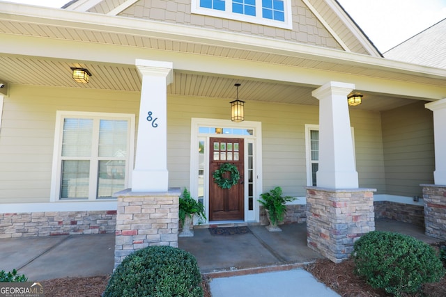 doorway to property featuring a porch