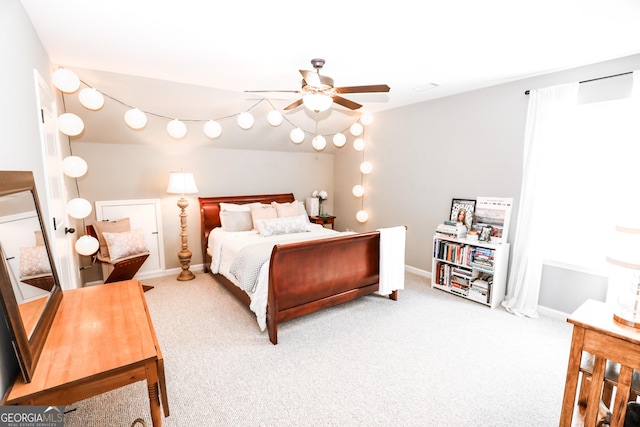 bedroom with ceiling fan, carpet, and baseboards