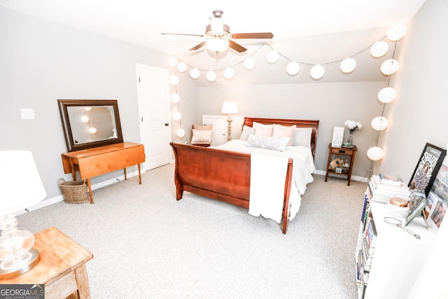 carpeted bedroom featuring ceiling fan and baseboards