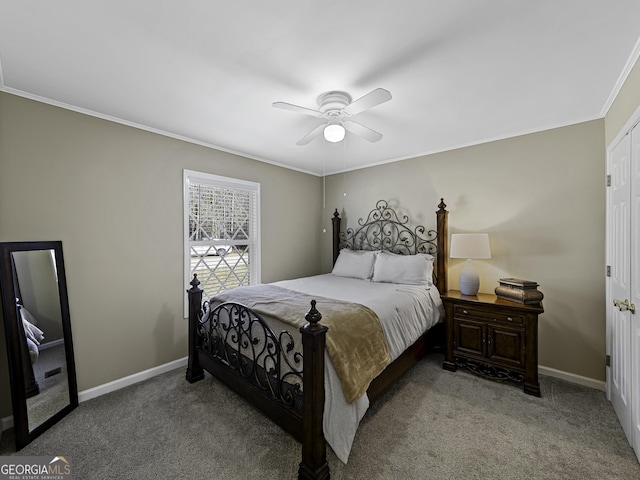 carpeted bedroom with ornamental molding, baseboards, and a ceiling fan