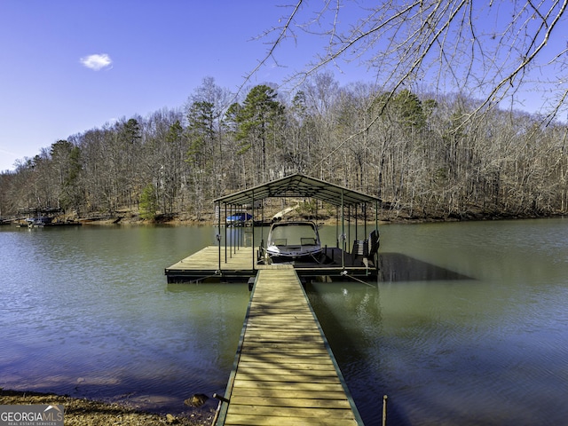 dock area featuring a water view and a view of trees