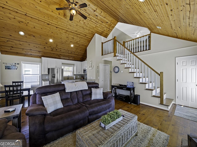 living room with a ceiling fan, wood ceiling, stairway, and dark wood-type flooring