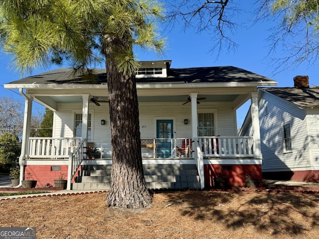 view of front of home with stairway, covered porch, and ceiling fan