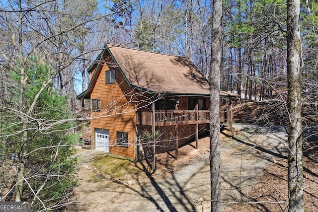 view of home's exterior featuring driveway and an attached garage