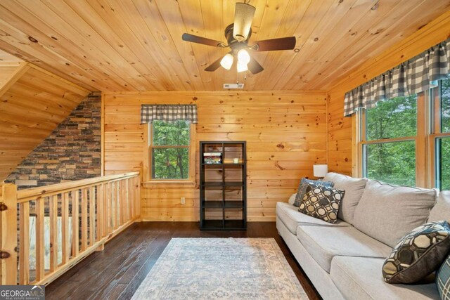 unfurnished living room with dark wood-style floors, wooden ceiling, and a healthy amount of sunlight