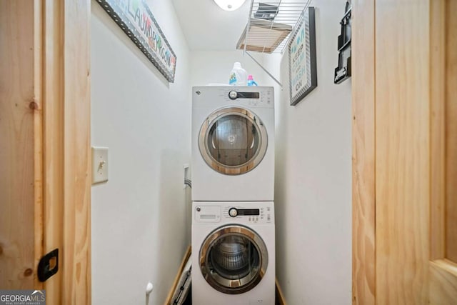 laundry area with stacked washer and clothes dryer