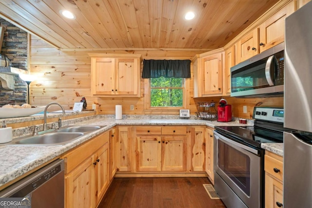 kitchen featuring light brown cabinets, a sink, wood ceiling, light countertops, and appliances with stainless steel finishes