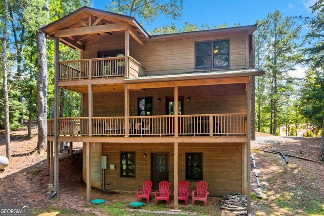 rear view of house featuring a deck