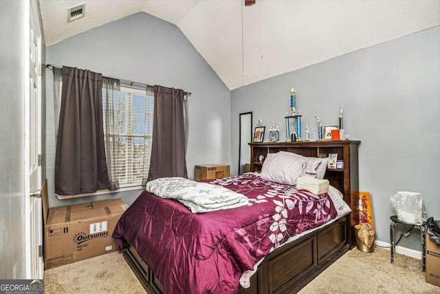 carpeted bedroom featuring baseboards, visible vents, vaulted ceiling, and a ceiling fan