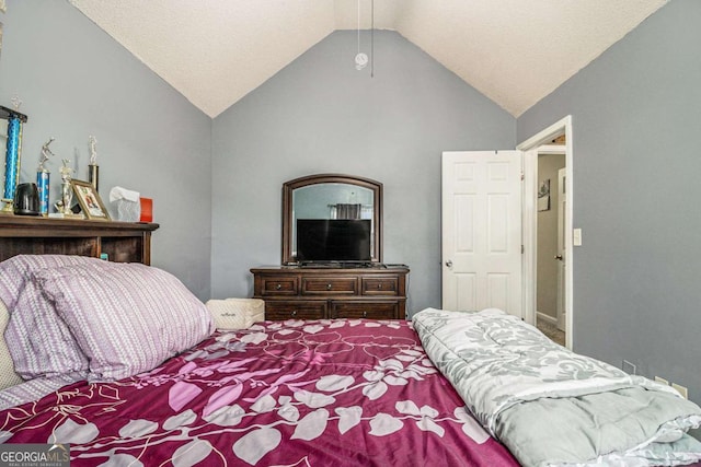 bedroom featuring lofted ceiling