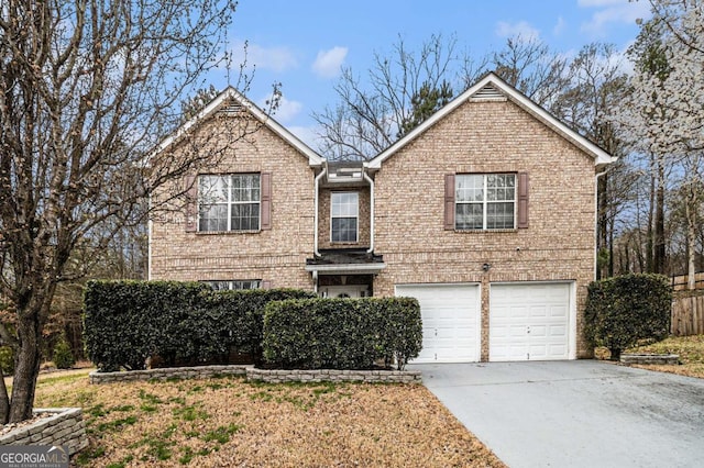 traditional-style home featuring driveway, brick siding, and an attached garage