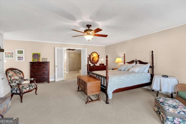 bedroom featuring connected bathroom, light carpet, a ceiling fan, french doors, and crown molding