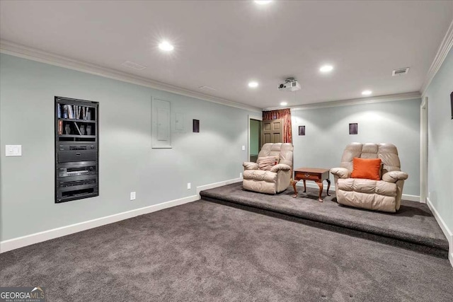 sitting room with carpet floors, recessed lighting, crown molding, and baseboards