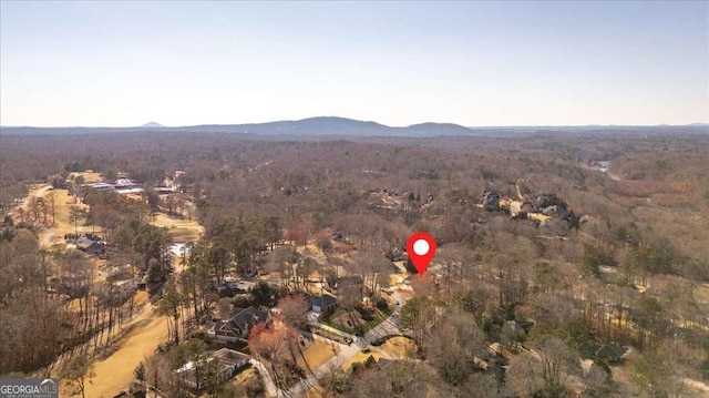 aerial view featuring a mountain view and a forest view