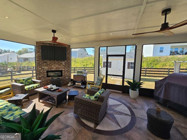 sunroom / solarium with ceiling fan