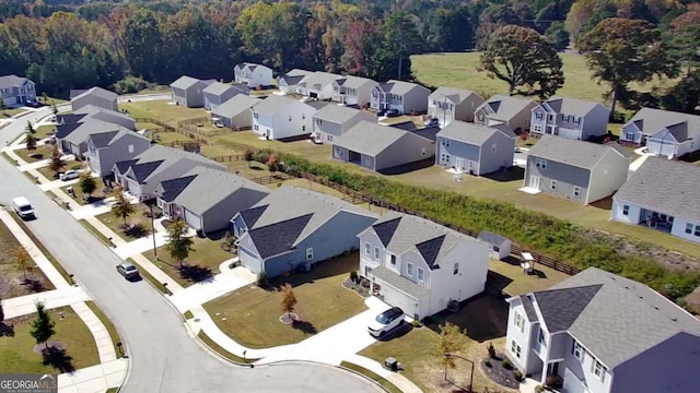 aerial view with a forest view and a residential view