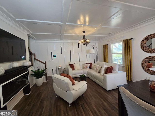 living area featuring stairs, dark wood-type flooring, coffered ceiling, and an inviting chandelier