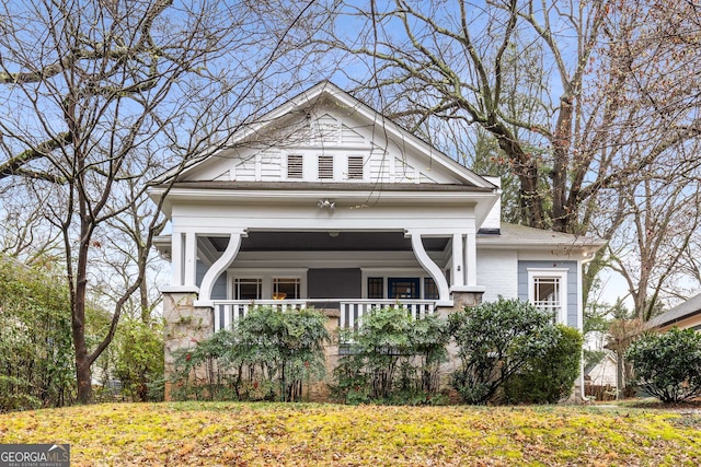 view of front of property with brick siding and covered porch