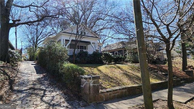 view of property exterior with a porch