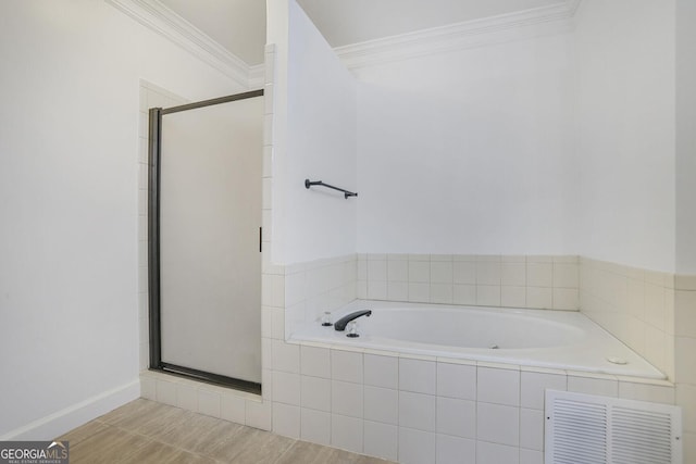 484 Martin St SE, Atlanta, GA 30312 - full bathroom with visible vents, a stall shower, a garden tub, and ornamental molding