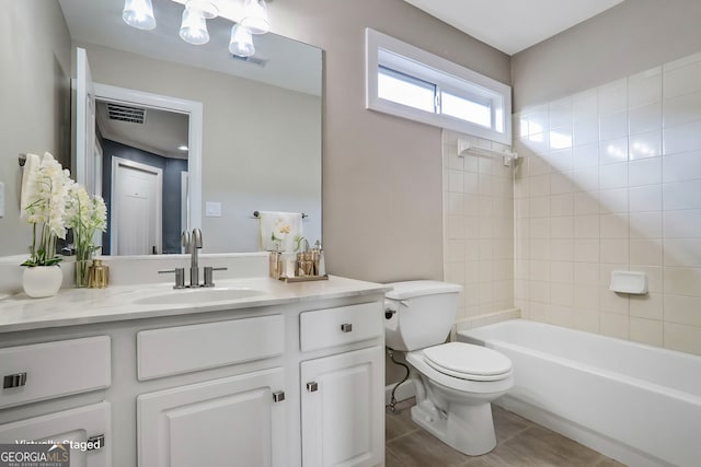 484 Martin St SE, Atlanta, GA 30312 - full bathroom with visible vents, toilet, vanity, and washtub / shower combination