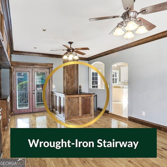 484 Martin St SE, Atlanta, GA 30312 - interior space with baseboards, ceiling fan, ornamental molding, wood finished floors, and arched walkways